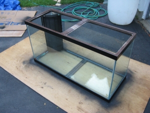 Re-painted the tank trim to be black instead of wood-grain. Used Krylon Fusion, it worked well with several coats. Did not do the tip-top so that there would be no chance of getting paint/paint chips in the tank