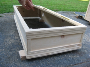The hood. It has two holes for ventilation fans and the lights will mount to that lid. If circulation isnt enough, I will cut the back of the hood open more.
