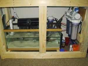 Sump up and running.  Mounted the RO/DI unit next to sump, next steep is an auto top off and get a light to start growing Macro Algae