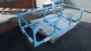 Picking up the custom stand from the powder coater