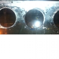 Overflow holes that I drilled with a Glass-holes hole saw for their 1" bulkheads.